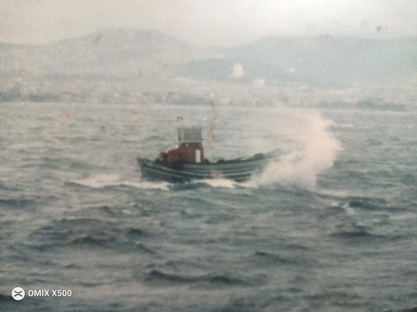 A tugboat sailing in the water